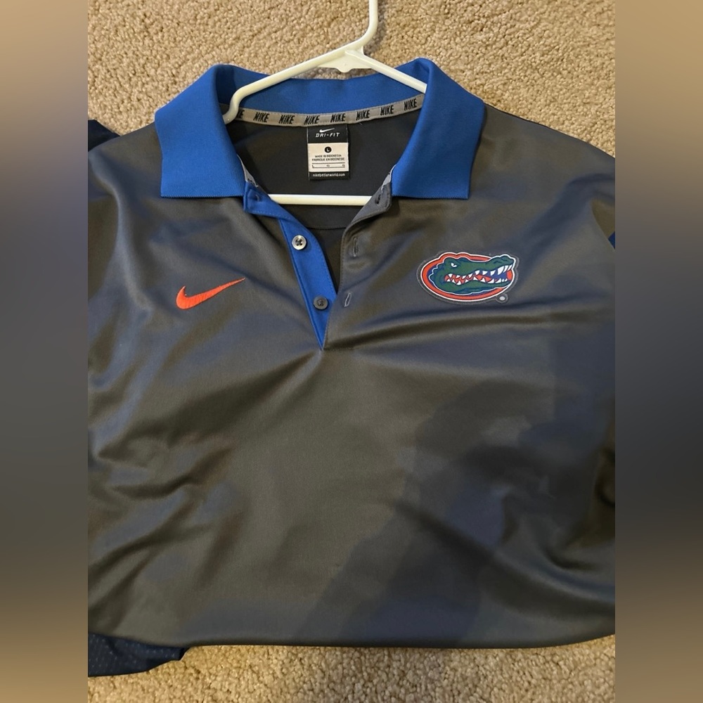 Used Nike Dri-Fit Florida Gators polo dark gray with blue sleeves size large